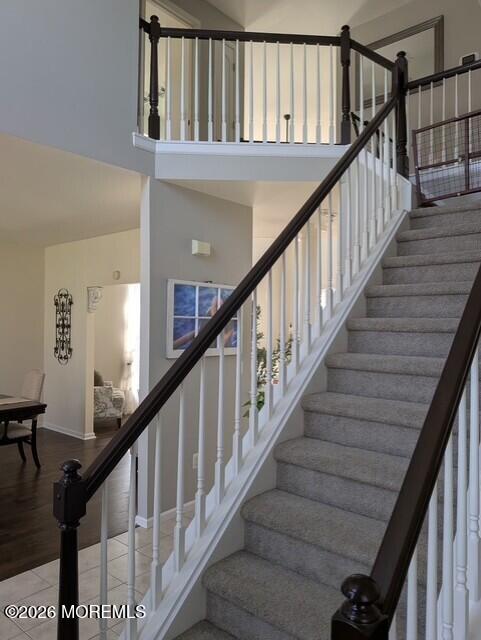 381 Leeward Road Manahawkin, NJ 08050 - Photo 15 of 17 a view of staircase with lots of frames on wall and wooden floor