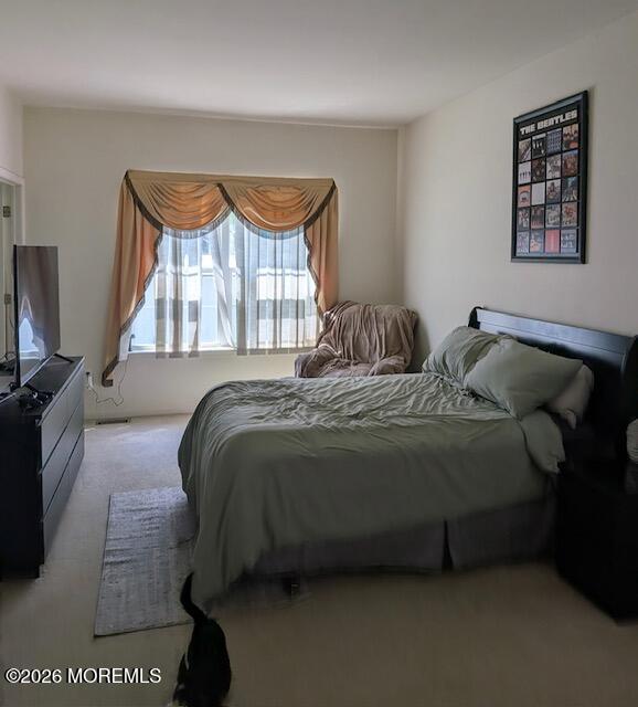 381 Leeward Road Manahawkin, NJ 08050 - Photo 17 of 17 a bed sitting in a bedroom next to a window