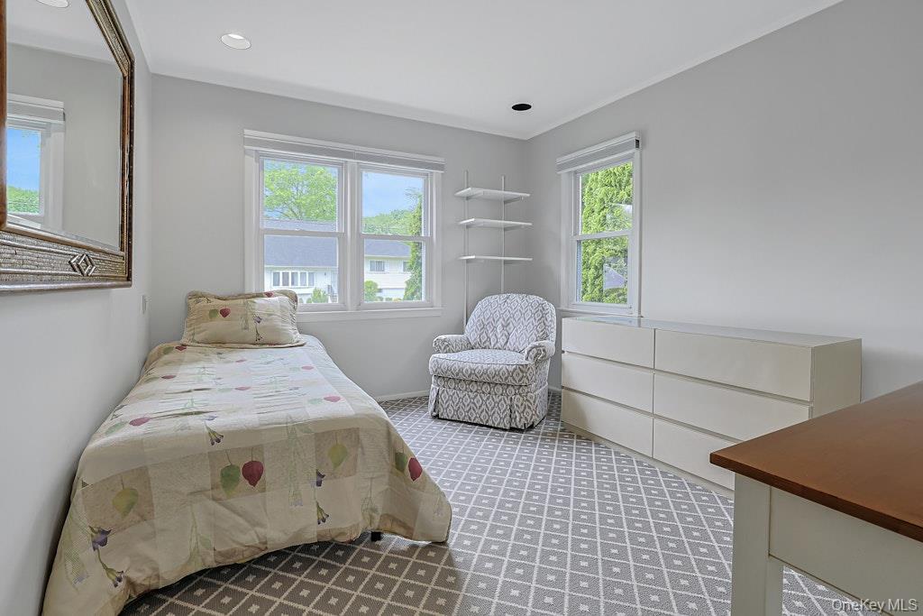 305 Stratton Road New Rochelle, NY 10804 - Photo 24 of 32 a spacious bedroom with a bed and wooden floor
