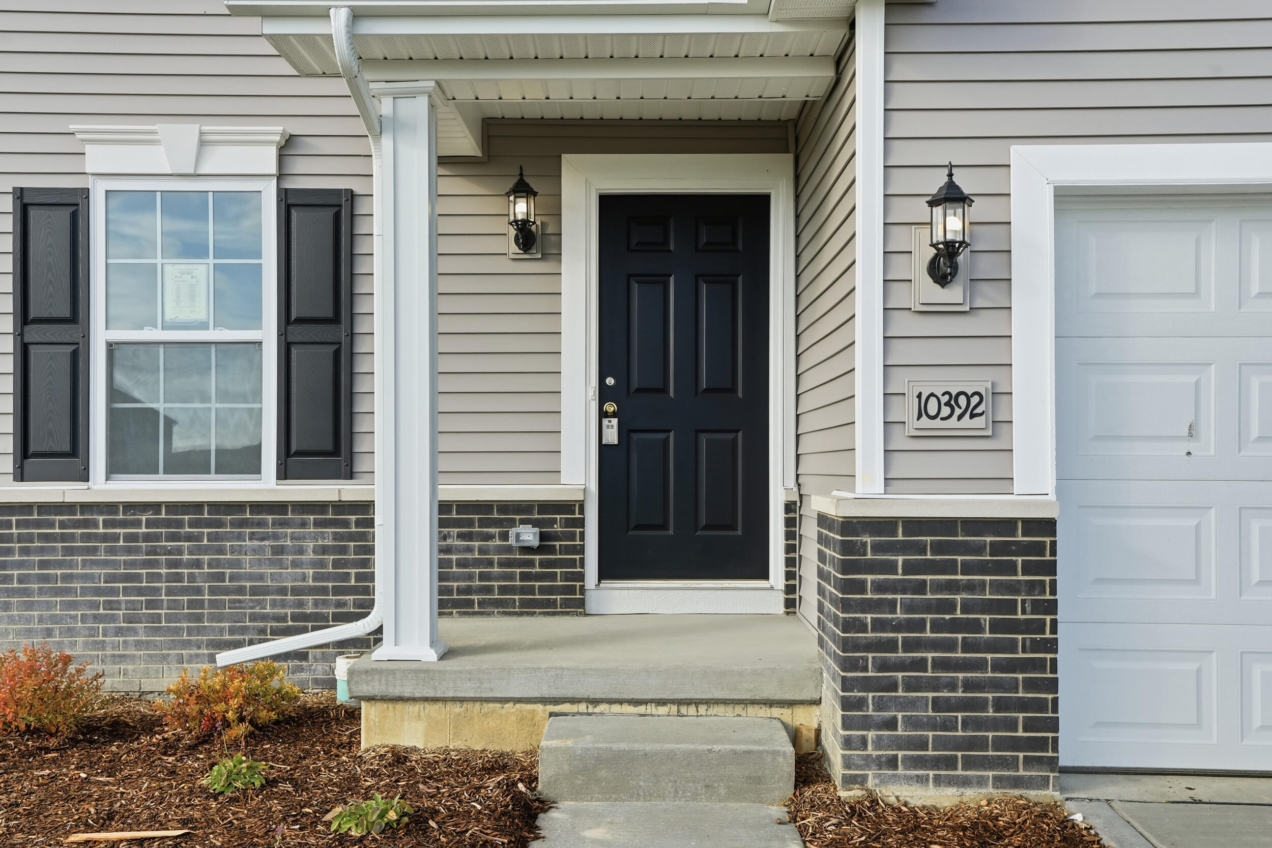 10392 Knox Street Crown Point, IN 46307 - Photo 31 of 31 a view of a brick house with large windows