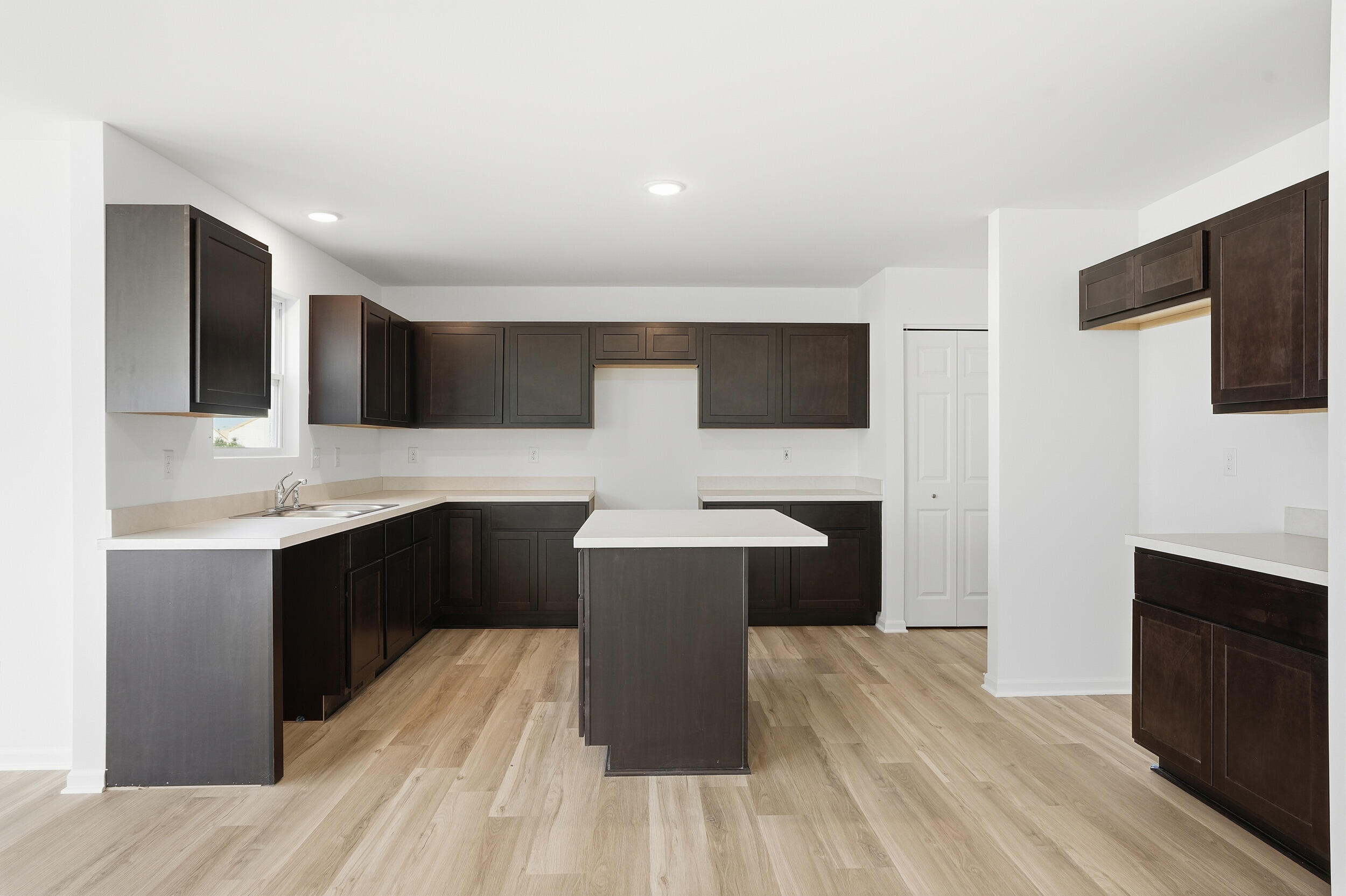 10392 Knox Street Crown Point, IN 46307 - Photo 4 of 31 a kitchen with a sink and cabinets