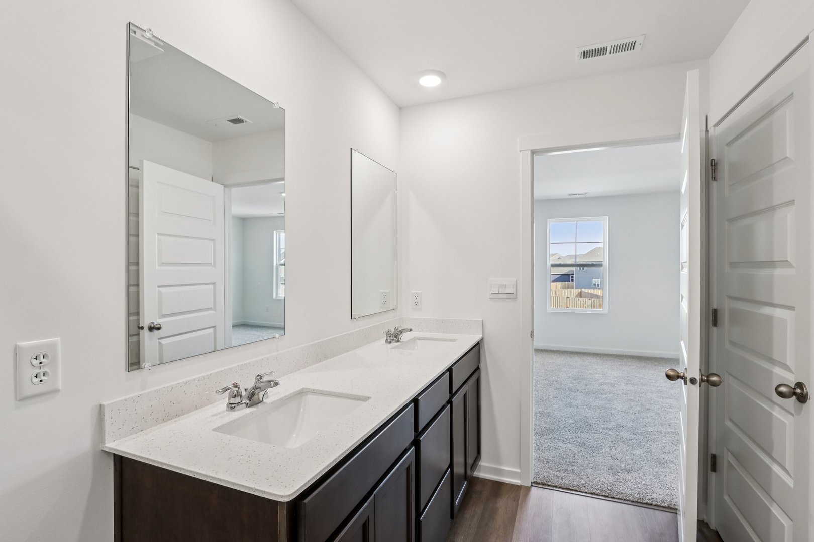 966 Garnet Lane Montgomery, IL 60538 - Photo 20 of 62 a bathroom with a sink double vanity and a mirror