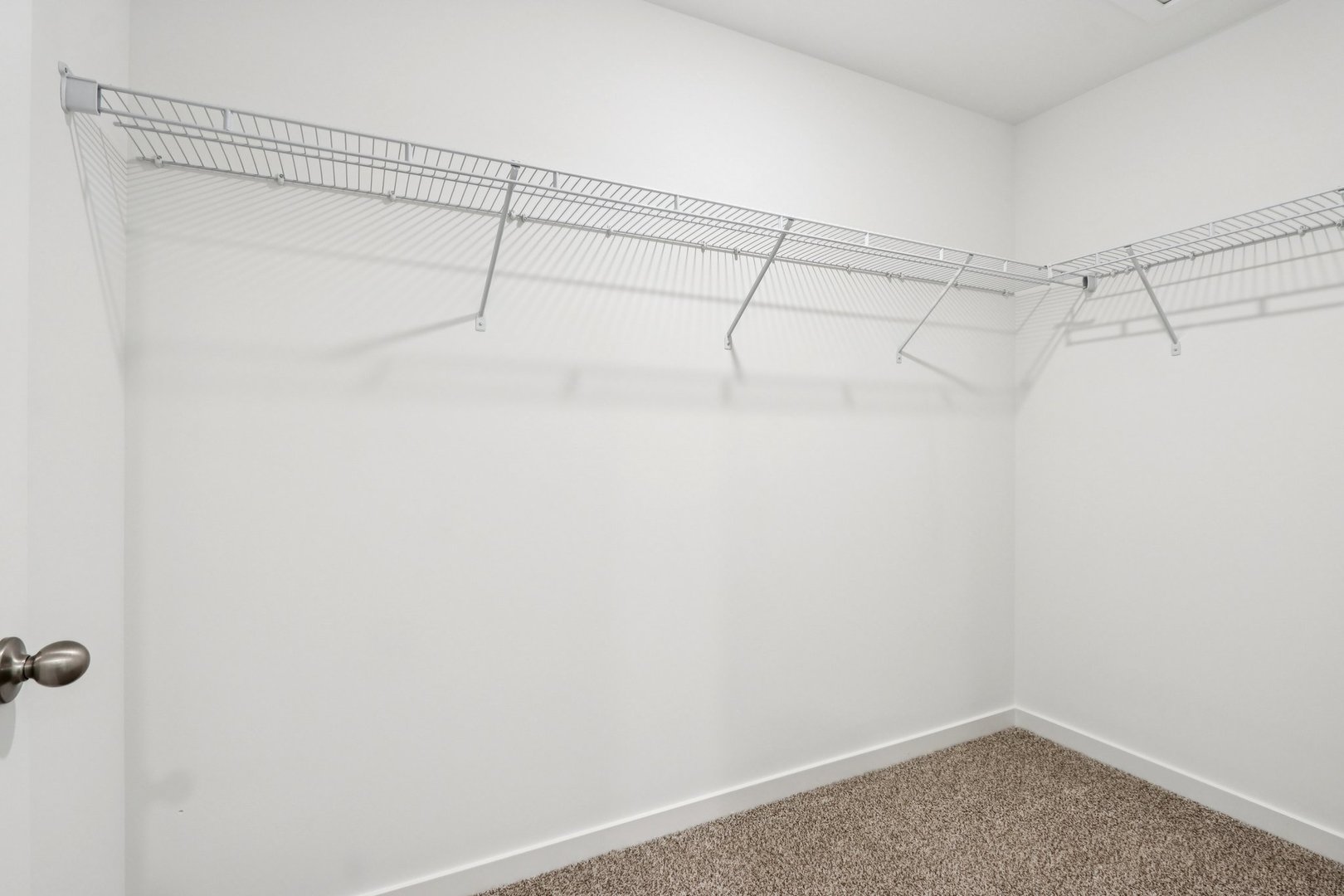 966 Garnet Lane Montgomery, IL 60538 - Photo 21 of 62 a view of a room with racks on the wall