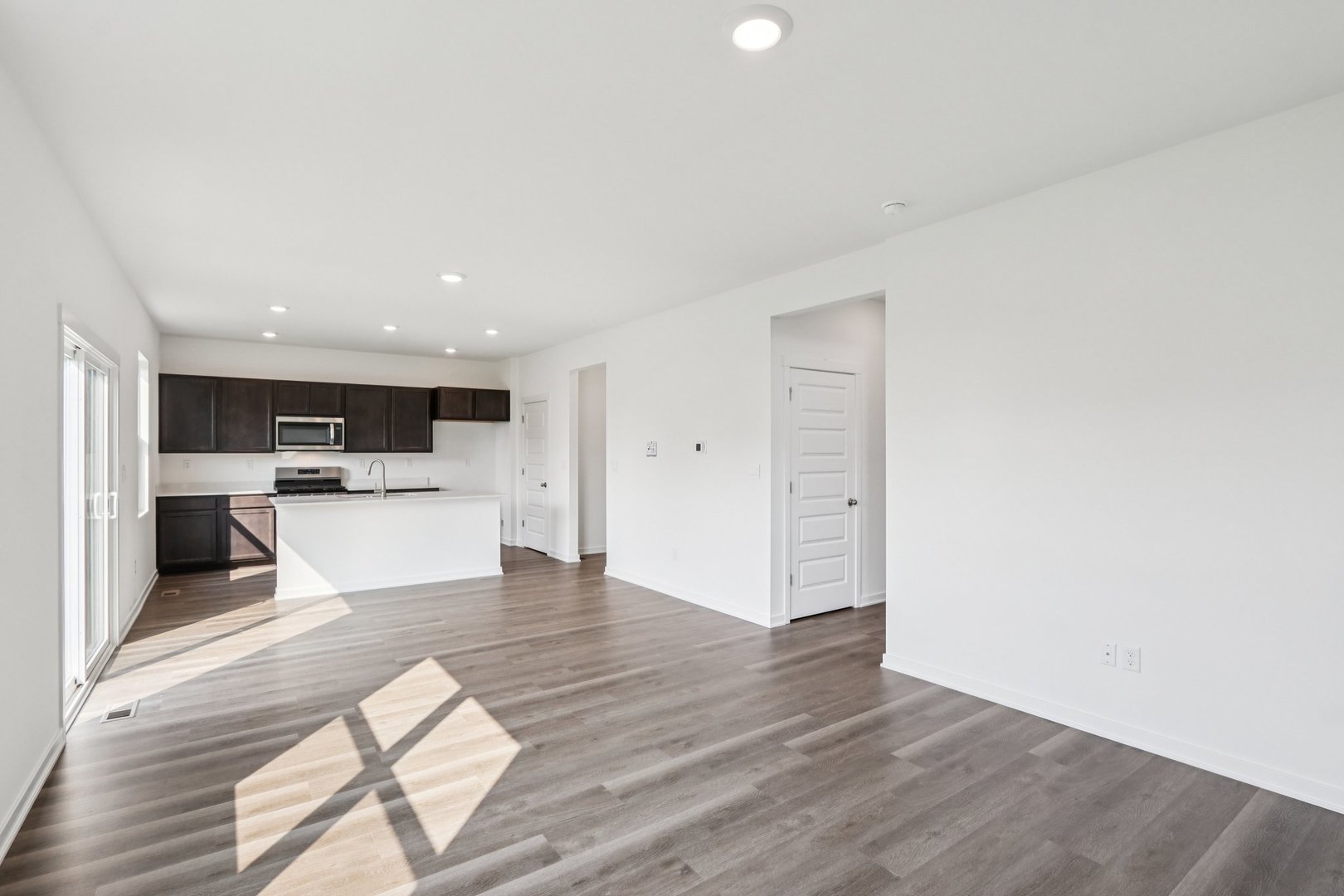 966 Garnet Lane Montgomery, IL 60538 - Photo 7 of 62 a view of kitchen with wooden floor and electronic appliances