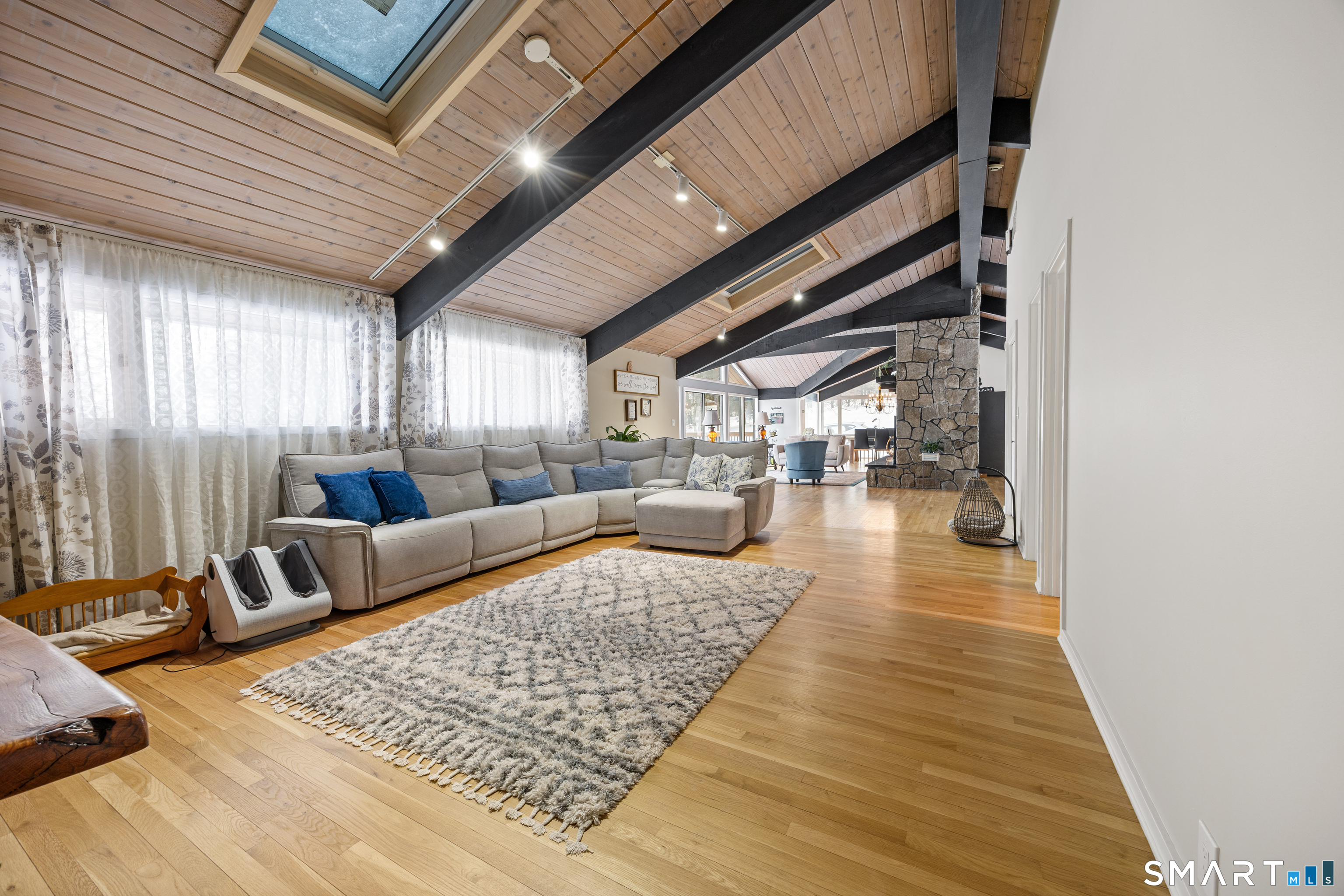 305 Westledge Drive Torrington, CT 06790 - Photo 16 of 37 a living room with furniture and a rug