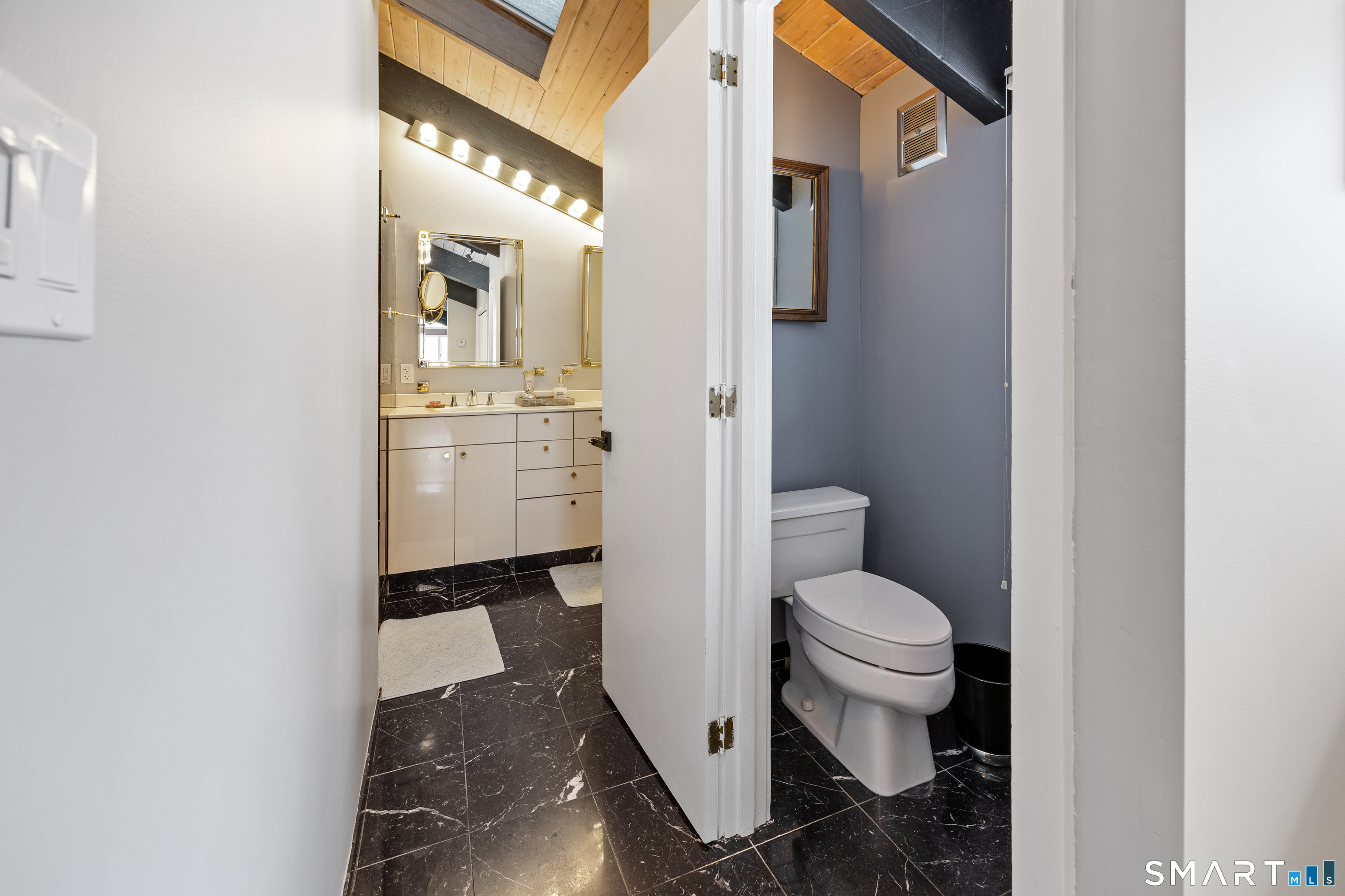305 Westledge Drive Torrington, CT 06790 - Photo 20 of 37 a bathroom with a granite countertop toilet and a sink