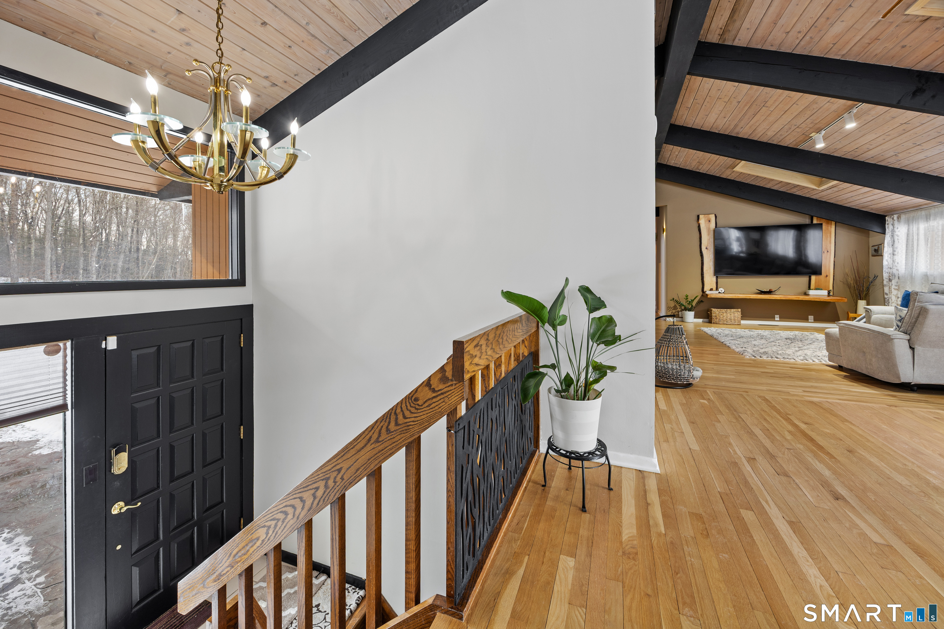 305 Westledge Drive Torrington, CT 06790 - Photo 26 of 37 a view of a dining room with furniture wooden floor and chandelier