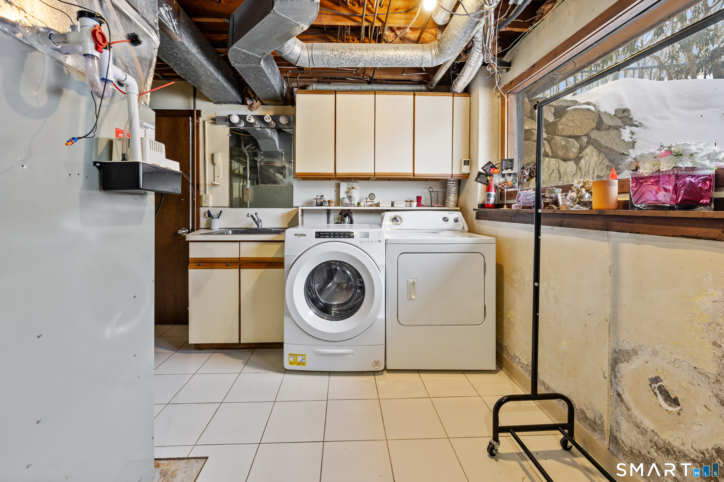 305 Westledge Drive Torrington, CT 06790 - Photo 27 of 37 a utility room with dryer and washer