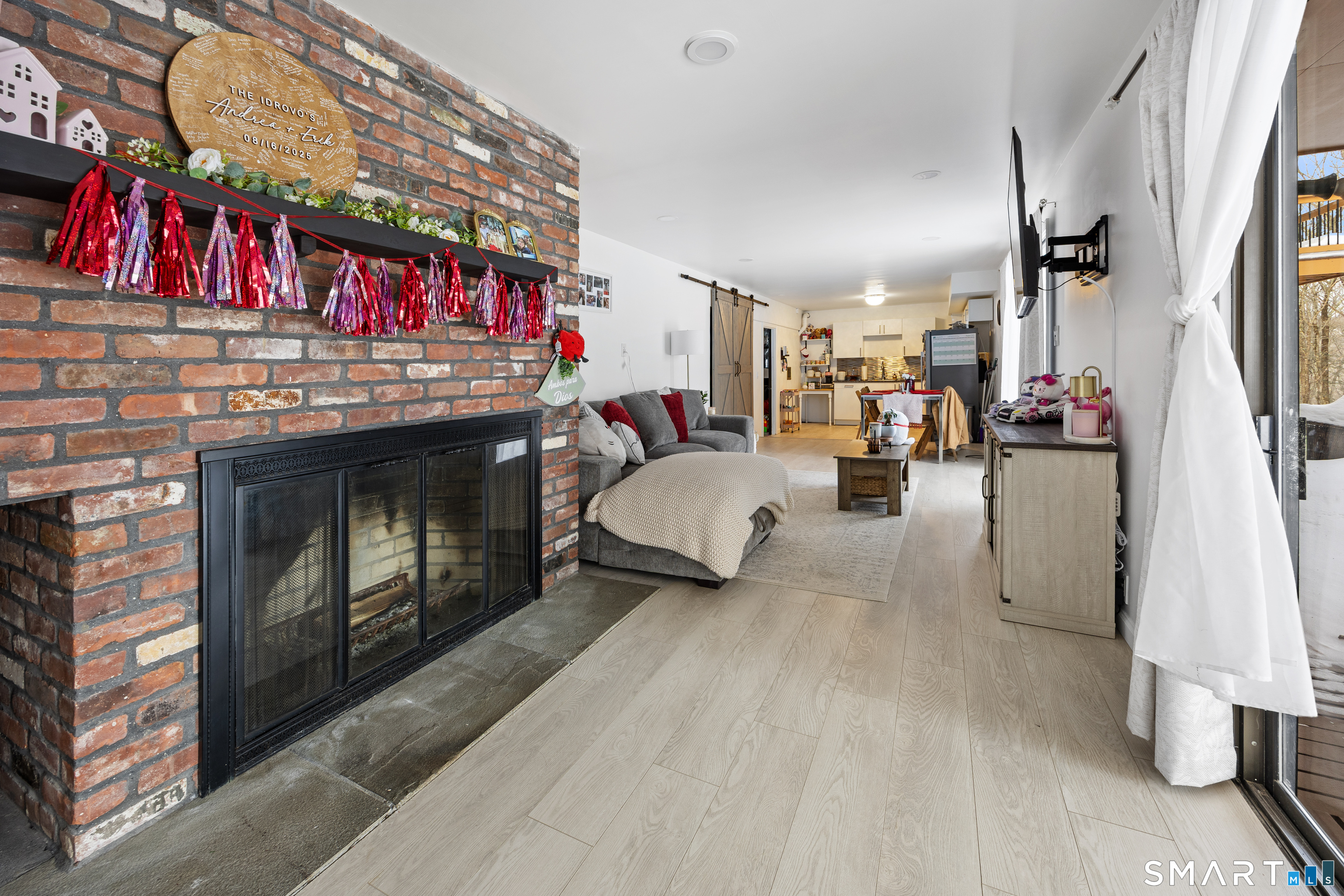 305 Westledge Drive Torrington, CT 06790 - Photo 32 of 37 a living room filled with furniture and a fireplace