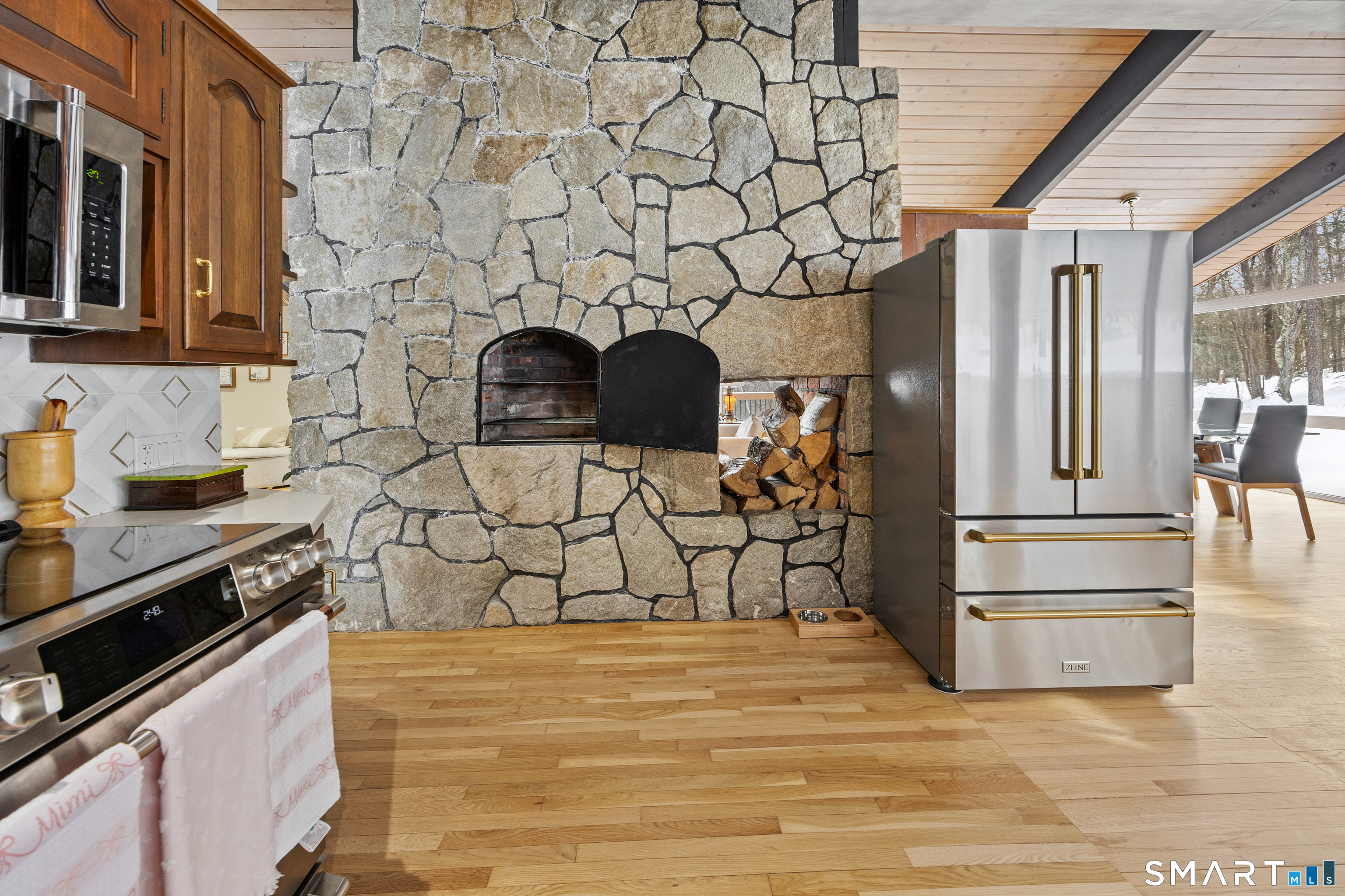 305 Westledge Drive Torrington, CT 06790 - Photo 10 of 37 a kitchen with stainless steel appliances granite countertop a stove and a refrigerator