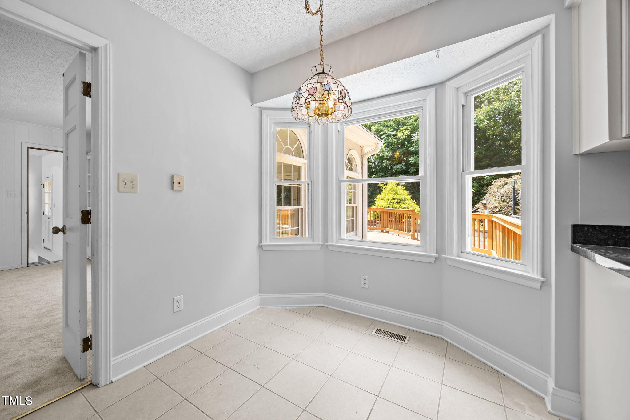 8909 Creekstone Court, Unit 11 Raleigh, NC 27615 - Photo 13 of 39 a view of an empty room with a window