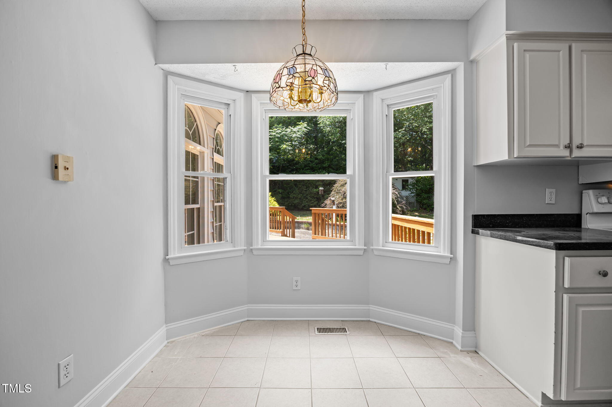 8909 Creekstone Court, Unit 11 Raleigh, NC 27615 - Photo 14 of 39 a window in an empty room with a window