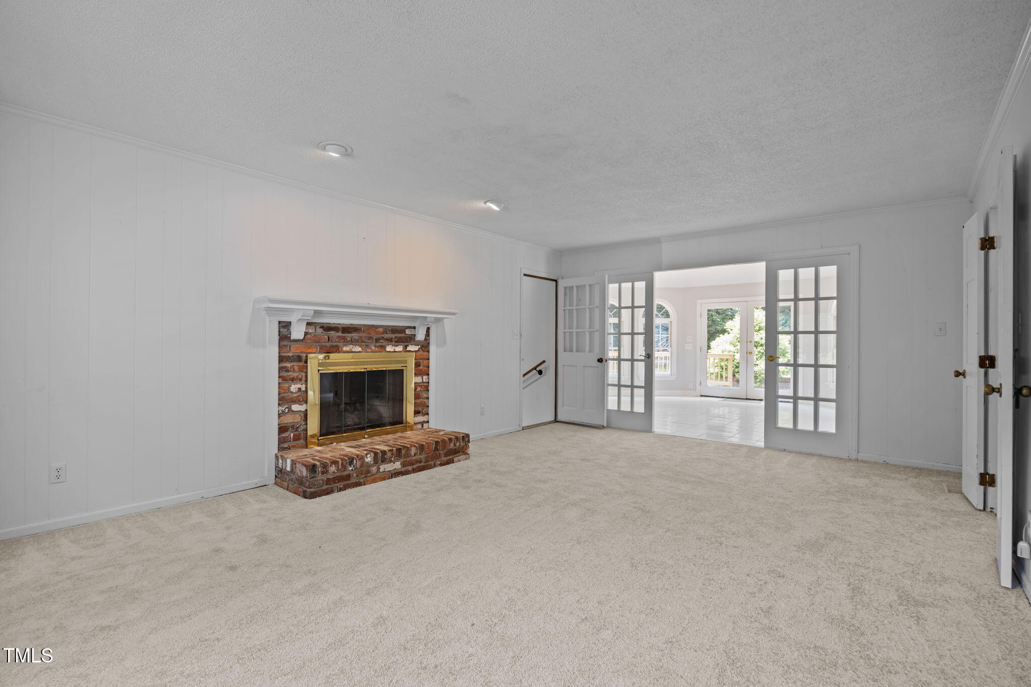 8909 Creekstone Court, Unit 11 Raleigh, NC 27615 - Photo 16 of 39 a living room with furniture and a fireplace