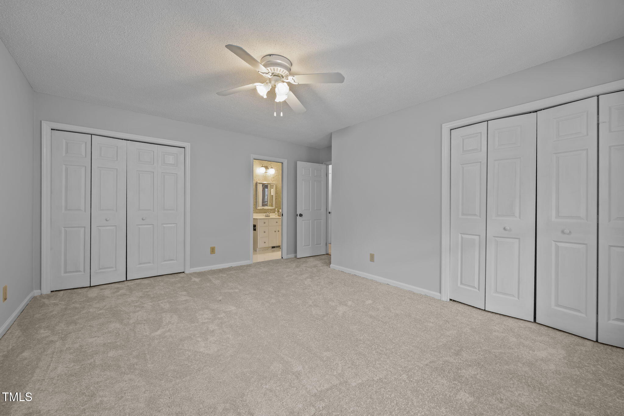 8909 Creekstone Court, Unit 11 Raleigh, NC 27615 - Photo 21 of 39 a view of an empty room with chandelier fan