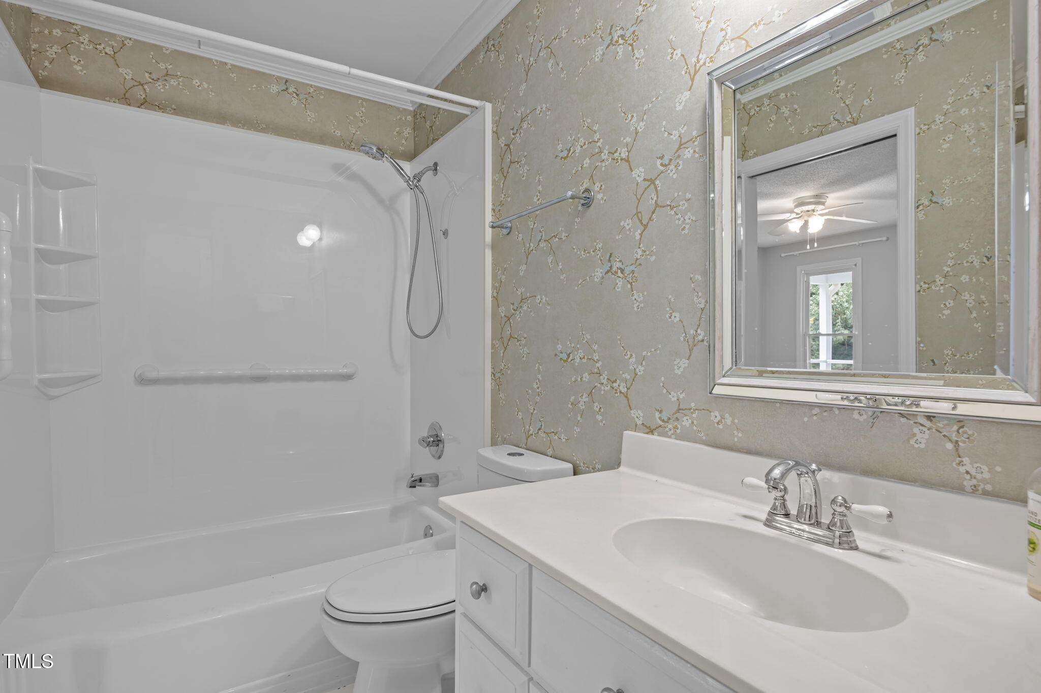 8909 Creekstone Court, Unit 11 Raleigh, NC 27615 - Photo 22 of 39 a bathroom with a sink a toilet and shower