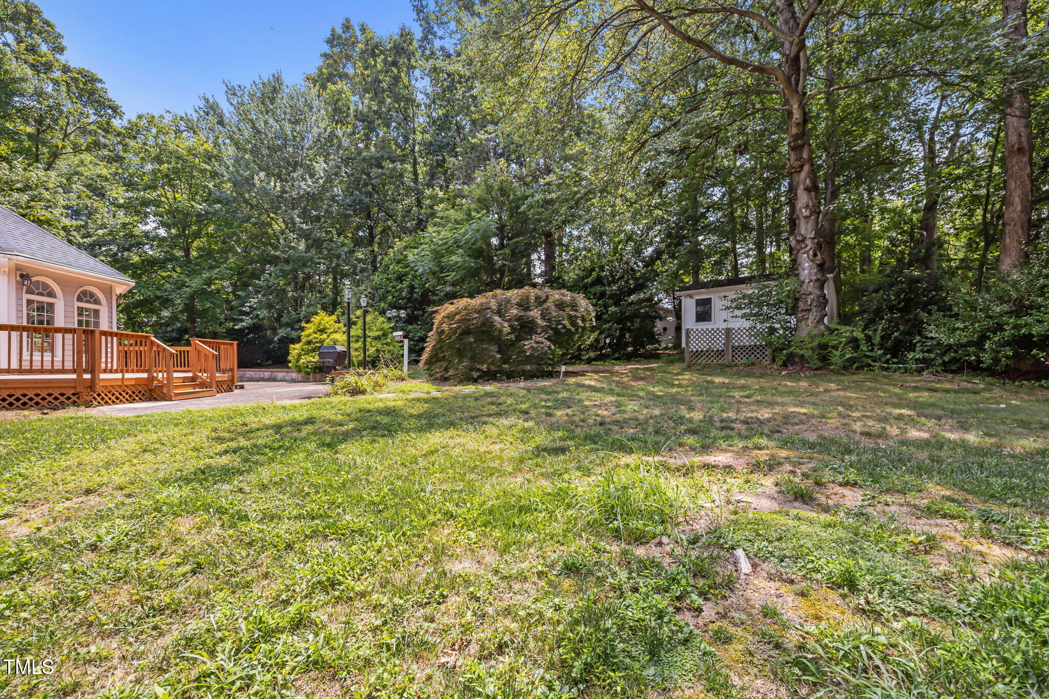 8909 Creekstone Court, Unit 11 Raleigh, NC 27615 - Photo 36 of 39 a view of a chairs and table in the garden