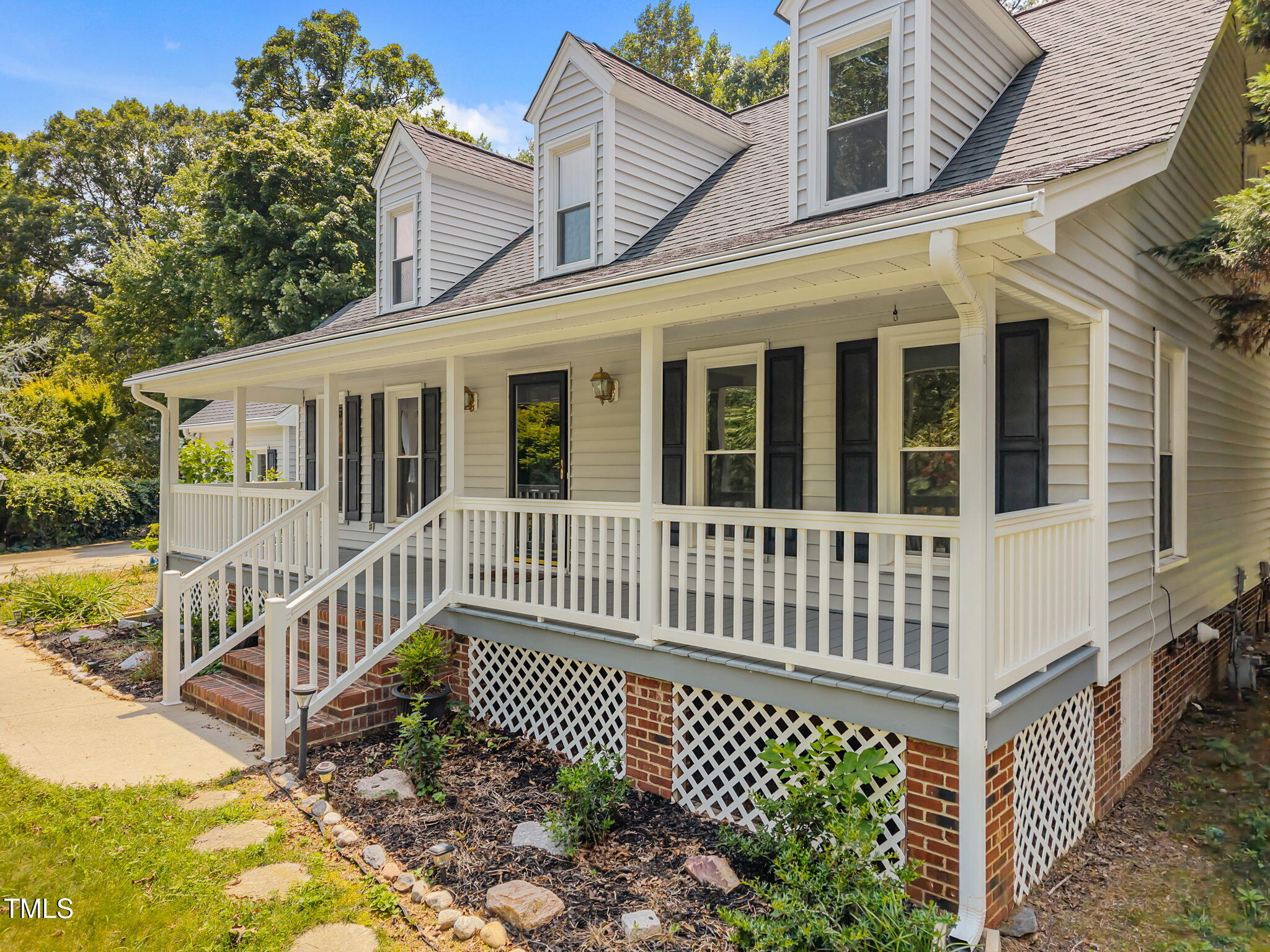 8909 Creekstone Court, Unit 11 Raleigh, NC 27615 - Photo 4 of 39 a view of a house with a small yard and wooden fence