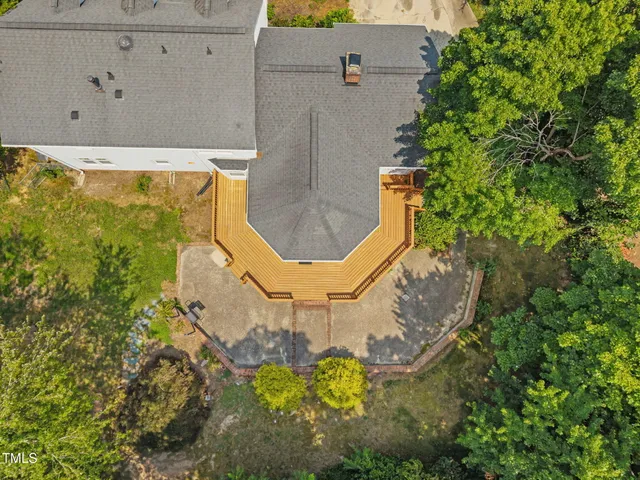 an aerial view of a house with a swimming pool
