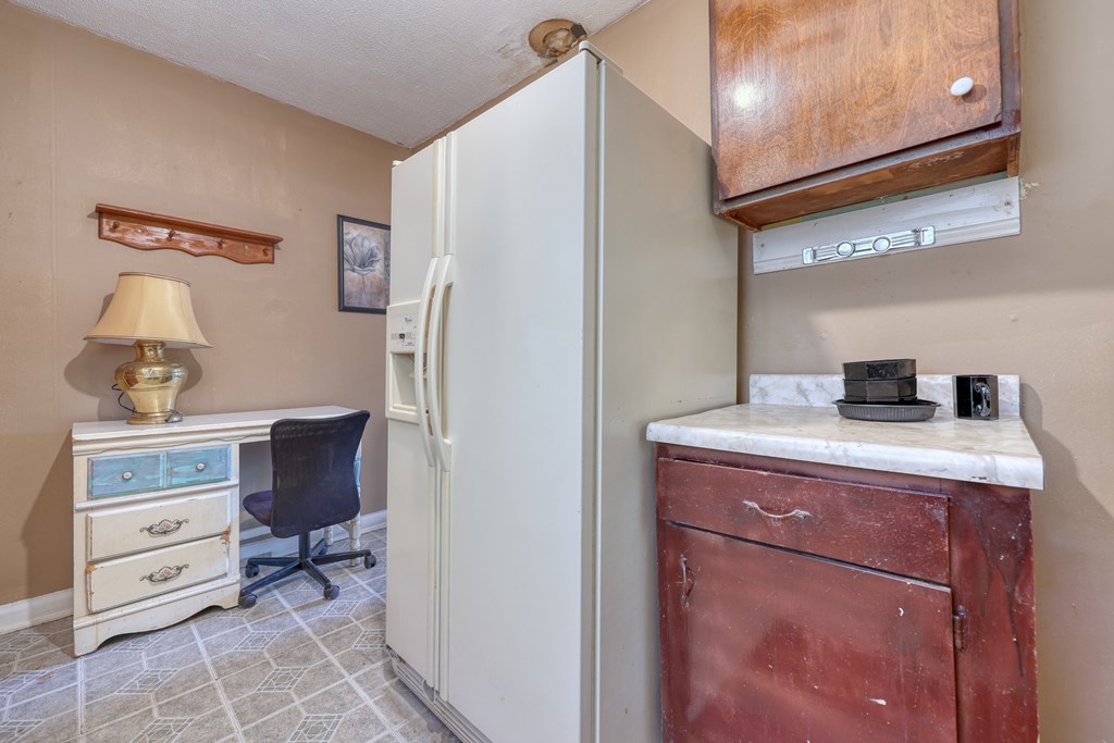 1641 16th Avenue Columbus, GA 31901 - Photo 14 of 76 a room with a cabinets and a dresser