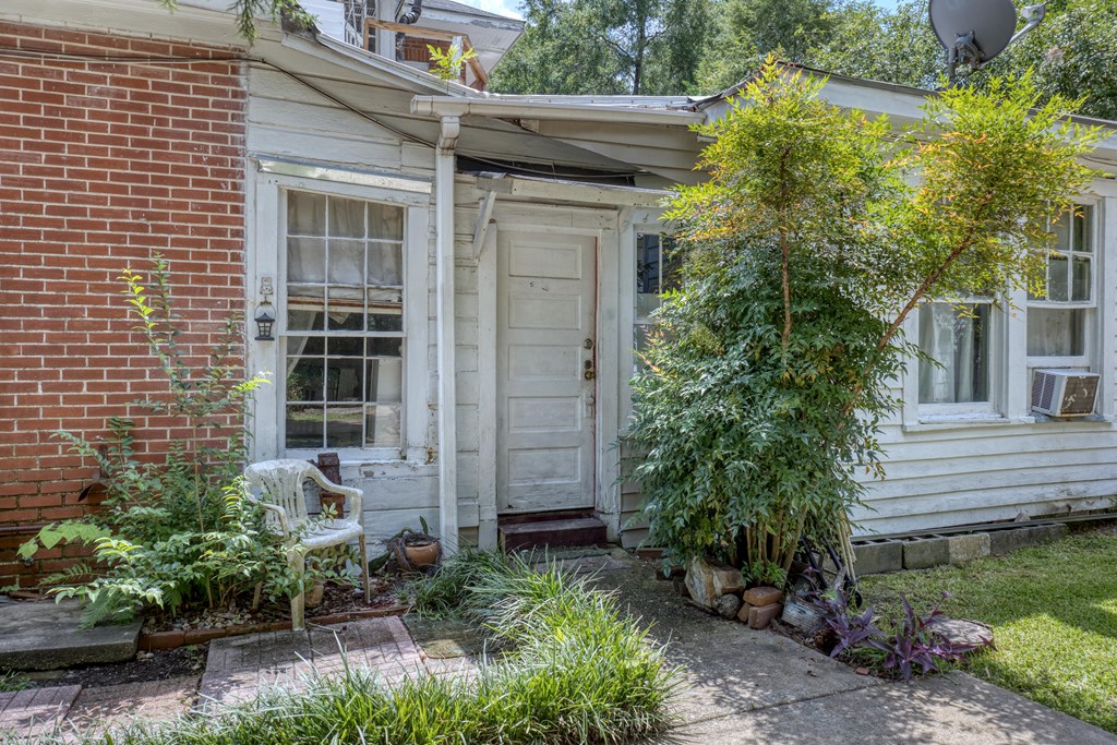 1641 16th Avenue Columbus, GA 31901 - Photo 19 of 76 a potted plant sitting in front of a house