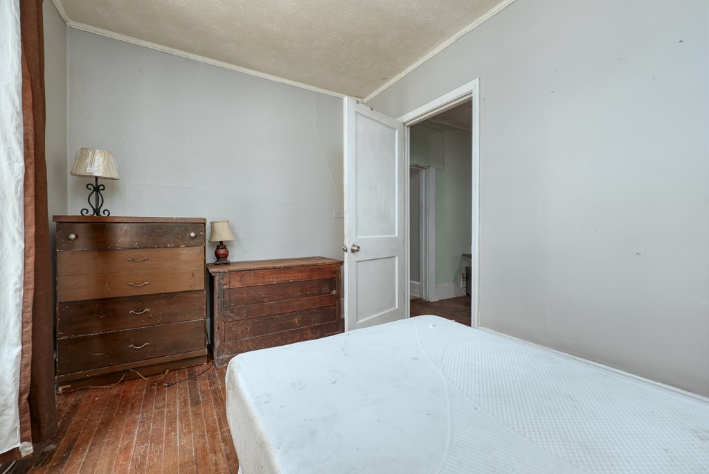 1641 16th Avenue Columbus, GA 31901 - Photo 24 of 76 a bedroom with a bed and cabinet