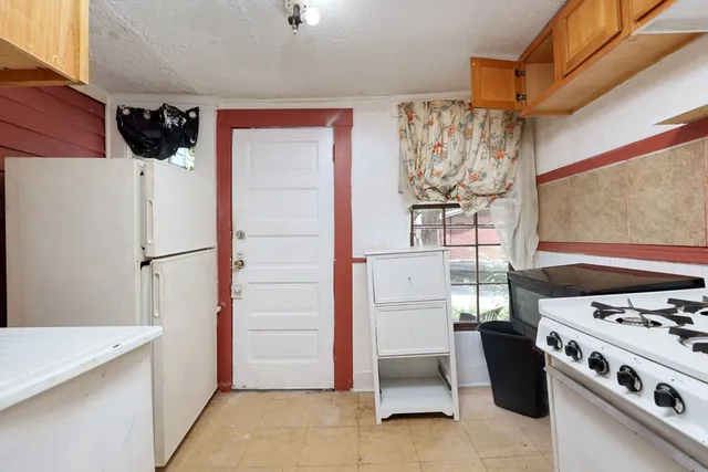 a bedroom with a bed and a mirror