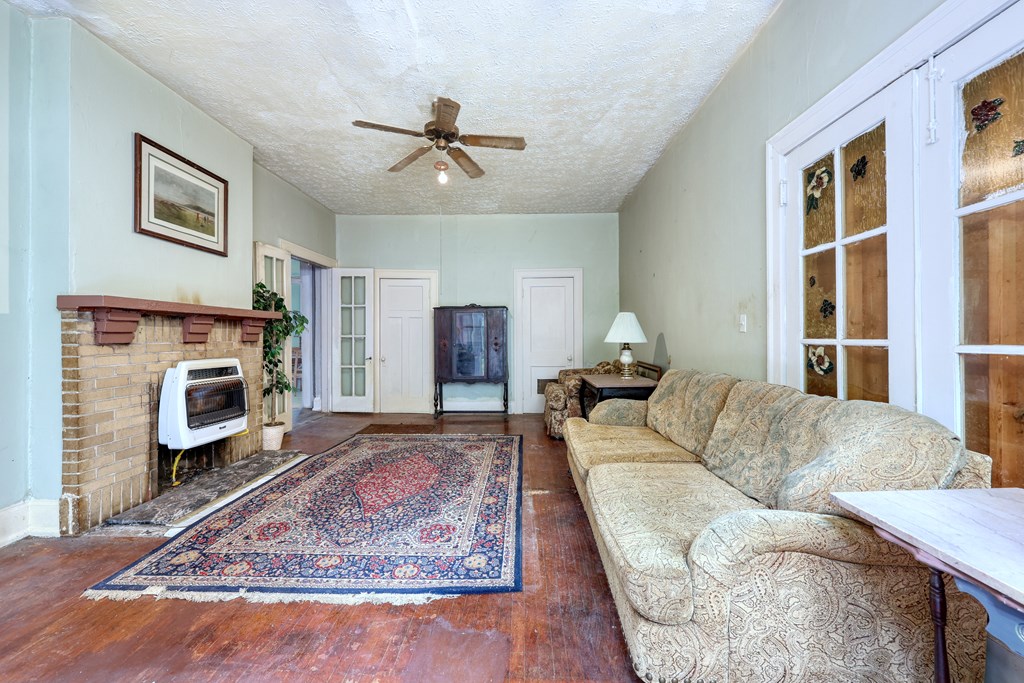 1641 16th Avenue Columbus, GA 31901 - Photo 30 of 76 a living room with furniture and a fireplace