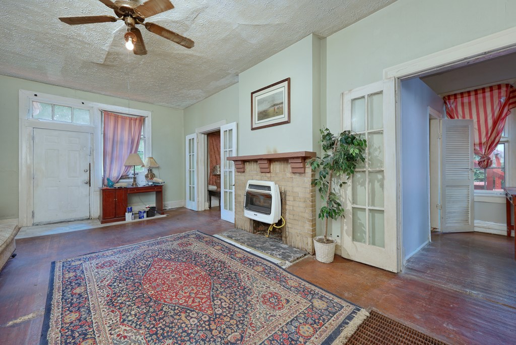 1641 16th Avenue Columbus, GA 31901 - Photo 31 of 76 a living room with furniture and a fireplace