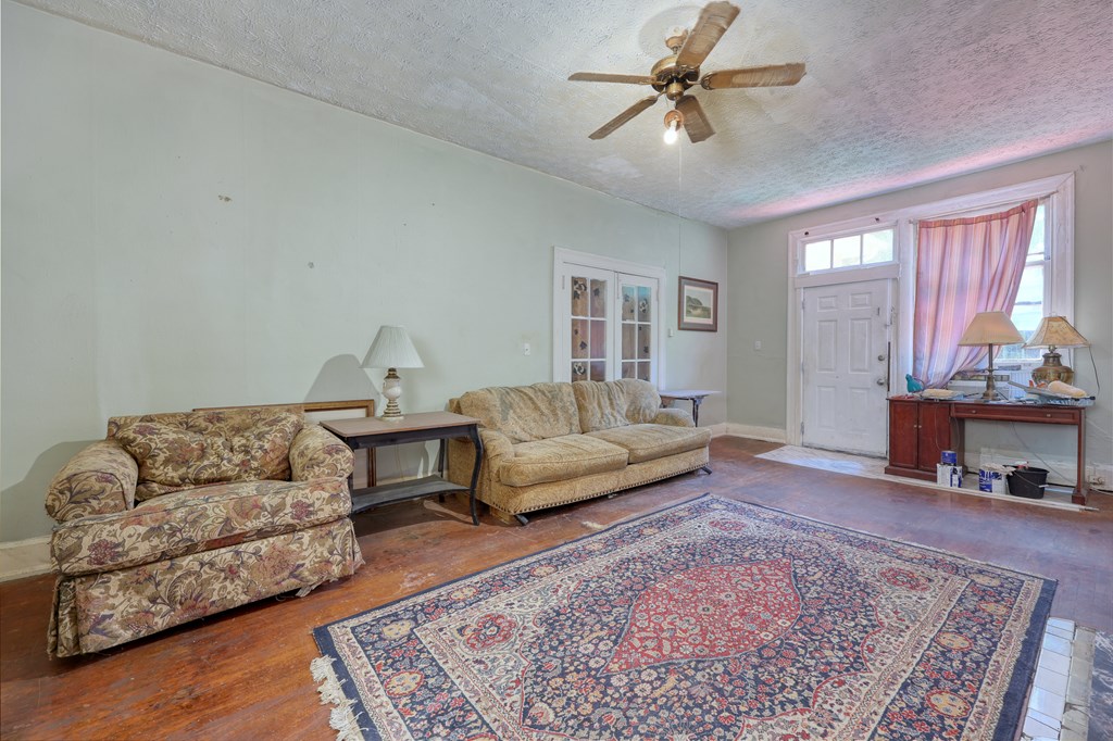 1641 16th Avenue Columbus, GA 31901 - Photo 32 of 76 a living room with furniture and a rug