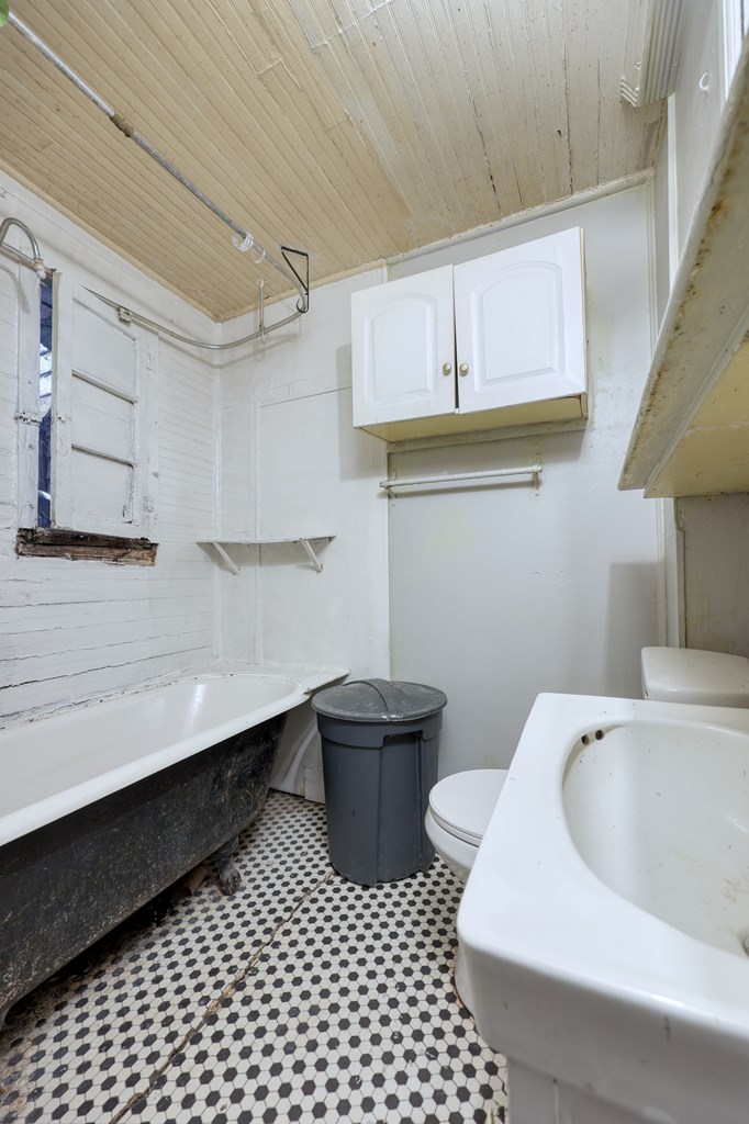 1641 16th Avenue Columbus, GA 31901 - Photo 40 of 76 a bathroom with a sink a toilet and vanity