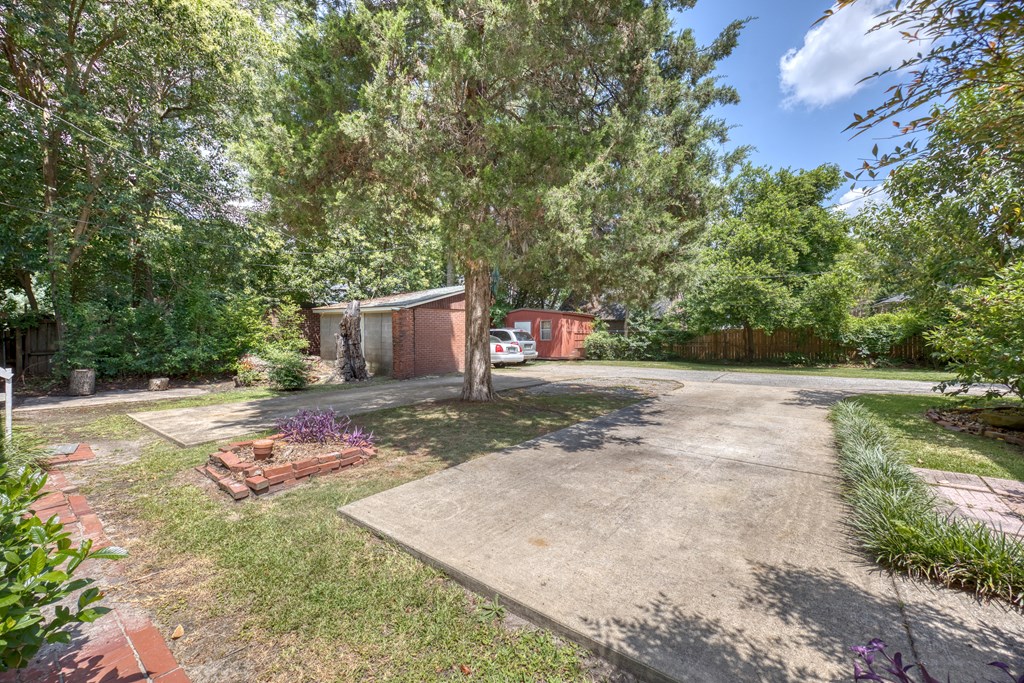 1641 16th Avenue Columbus, GA 31901 - Photo 48 of 76 a backyard of a house with yard and trampoline