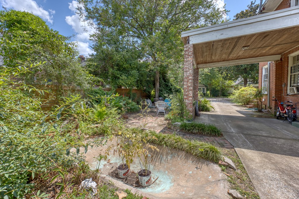 1641 16th Avenue Columbus, GA 31901 - Photo 52 of 76 a backyard of a house with fountain table and chairs