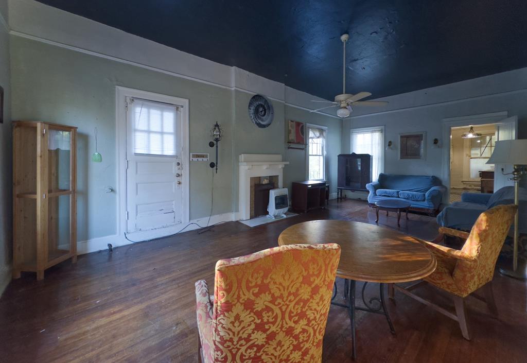 1641 16th Avenue Columbus, GA 31901 - Photo 61 of 76 a living room with fireplace furniture and a wooden floor