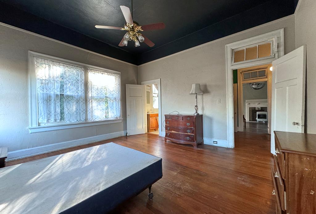 1641 16th Avenue Columbus, GA 31901 - Photo 64 of 76 a view of an empty room with wooden floor and a window