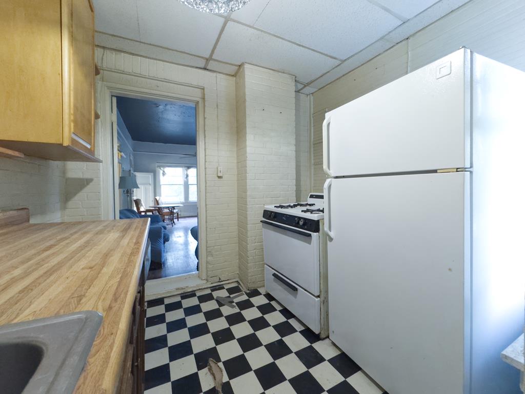 1641 16th Avenue Columbus, GA 31901 - Photo 67 of 76 a kitchen with a refrigerator and a stove