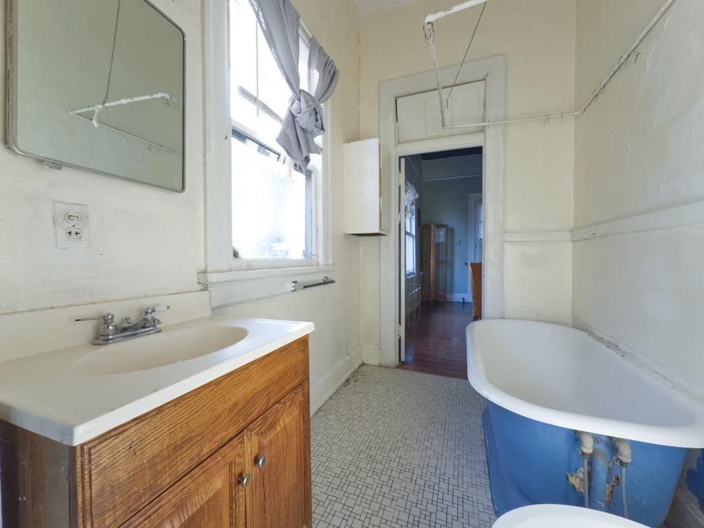 1641 16th Avenue Columbus, GA 31901 - Photo 68 of 76 a bathroom with a sink and a bathtub