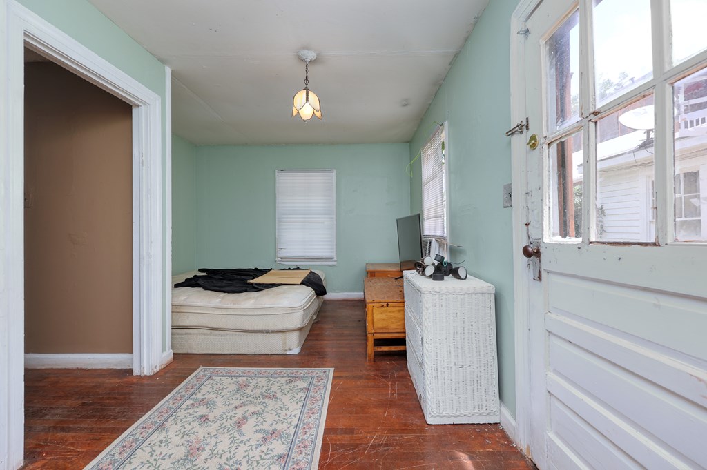 1641 16th Avenue Columbus, GA 31901 - Photo 8 of 76 a living room with a couch and a table