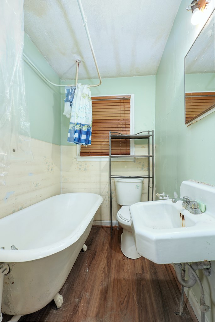 1641 16th Avenue Columbus, GA 31901 - Photo 10 of 76 a bathroom with a tub sink and mirror