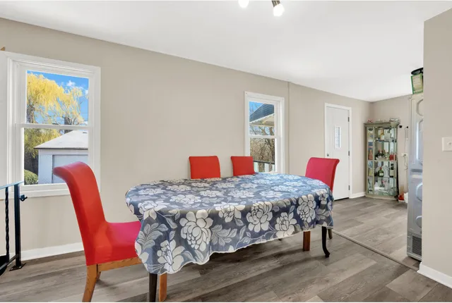 a bedroom with a bed a table and chair