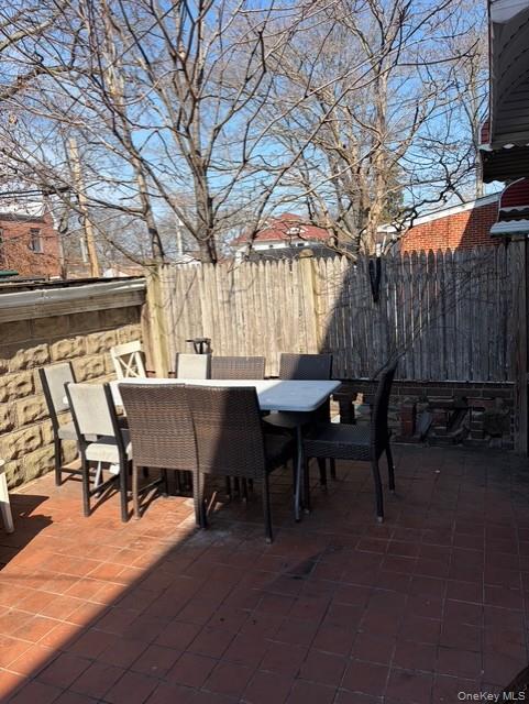 75-08 169th Street Queens, NY 11366 - Photo 13 of 13 a view of a dinning tables and chairs in the patio