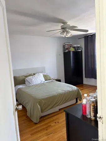 a bedroom with a bed and a mirror