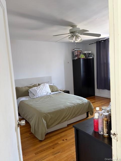 75-08 169th Street Queens, NY 11366 - Photo 7 of 13 a bedroom with a bed and a mirror