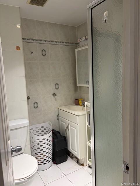 75-08 169th Street Queens, NY 11366 - Photo 9 of 13 a bathroom with a sink toilet and shower