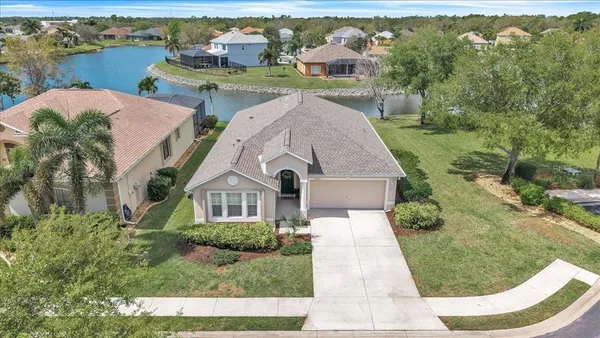 an aerial view of a house with outdoor space