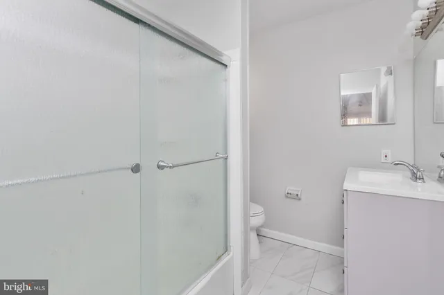 a bathroom with a sink and toilet