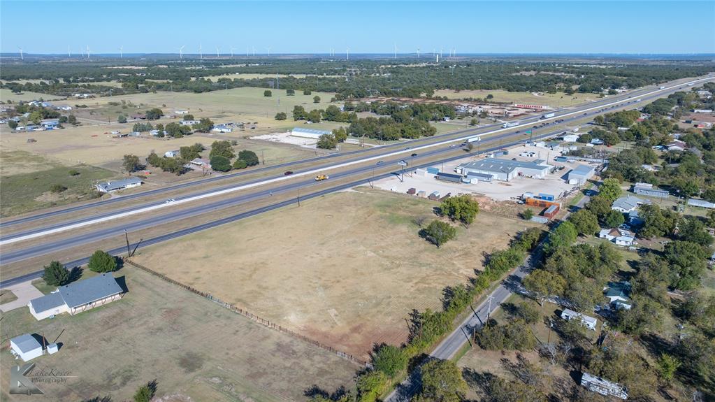 1823 South Access Road Clyde, TX 79510 - Photo 13 of 15 Aerial view of property's location featuring a tree filled landscape