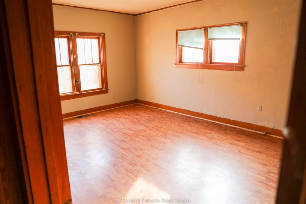 411 North McKinley Avenue Rotan, TX 79546 - Photo 17 of 25 a view of an empty room with a window