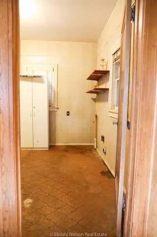 a kitchen with stainless steel appliances a sink and a refrigerator