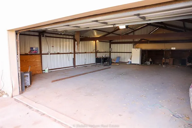 a living room with fireplace furniture and a window