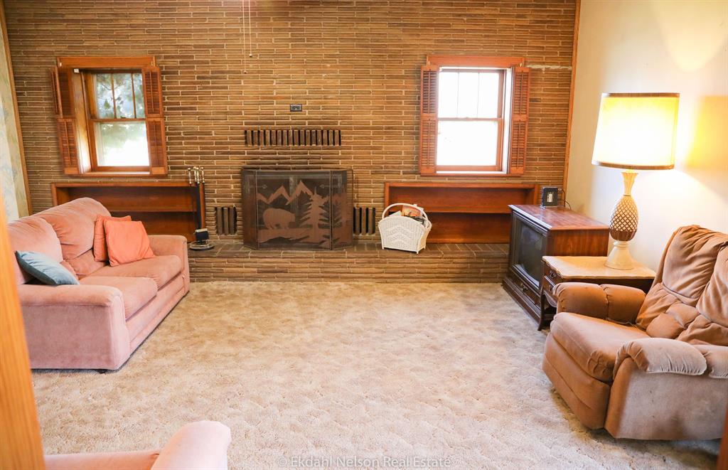 411 North McKinley Avenue Rotan, TX 79546 - Photo 6 of 25 a living room with fireplace furniture and a window